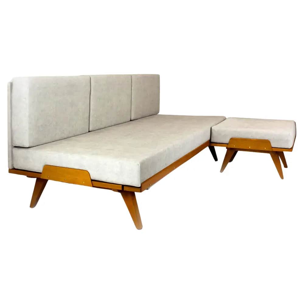 A Mid-Century Modern style daybed featuring a light-toned wooden frame and light grey fabric upholst… — 3D model