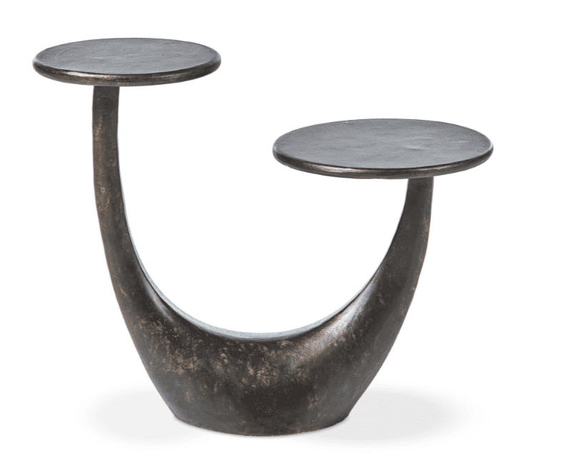 A dark-colored, metallic end table with a sculptural, U-shaped base supporting two circular tabletop… — 3D model