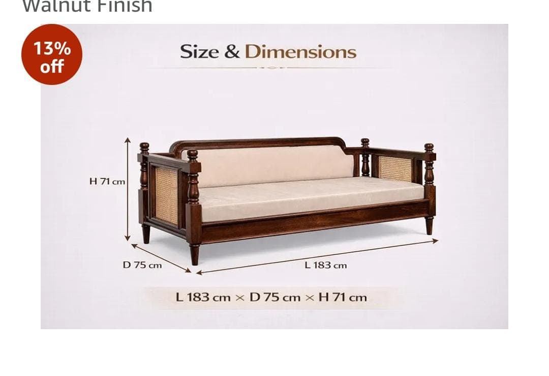 A traditional wooden daybed or diwan, featuring a dark stained wood frame, intricate cane webbing on the side panels, and a partially upholstered backrest. It is equipped with turned wooden legs and decorative finials, topped with a light-colored, plush mattress cushion. — 3D model