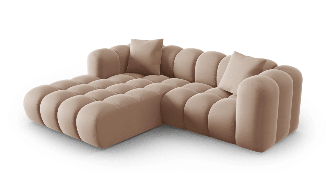 A modern L-shaped sectional sofa featuring a distinctive bubble-tufted design across its seat, backrest, and armrests. The sofa is upholstered in a soft, light taupe velvet-effect fabric and includes two matching square throw pillows. Its plush, rounded modular appearance creates an inviting and comfortable seating arrangement. — 3D model