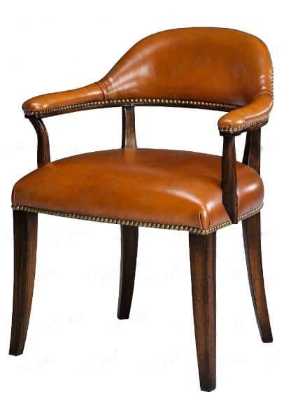 A traditional barrel-back armchair featuring cognac-colored leather upholstery with visible nailhead… — 3D model