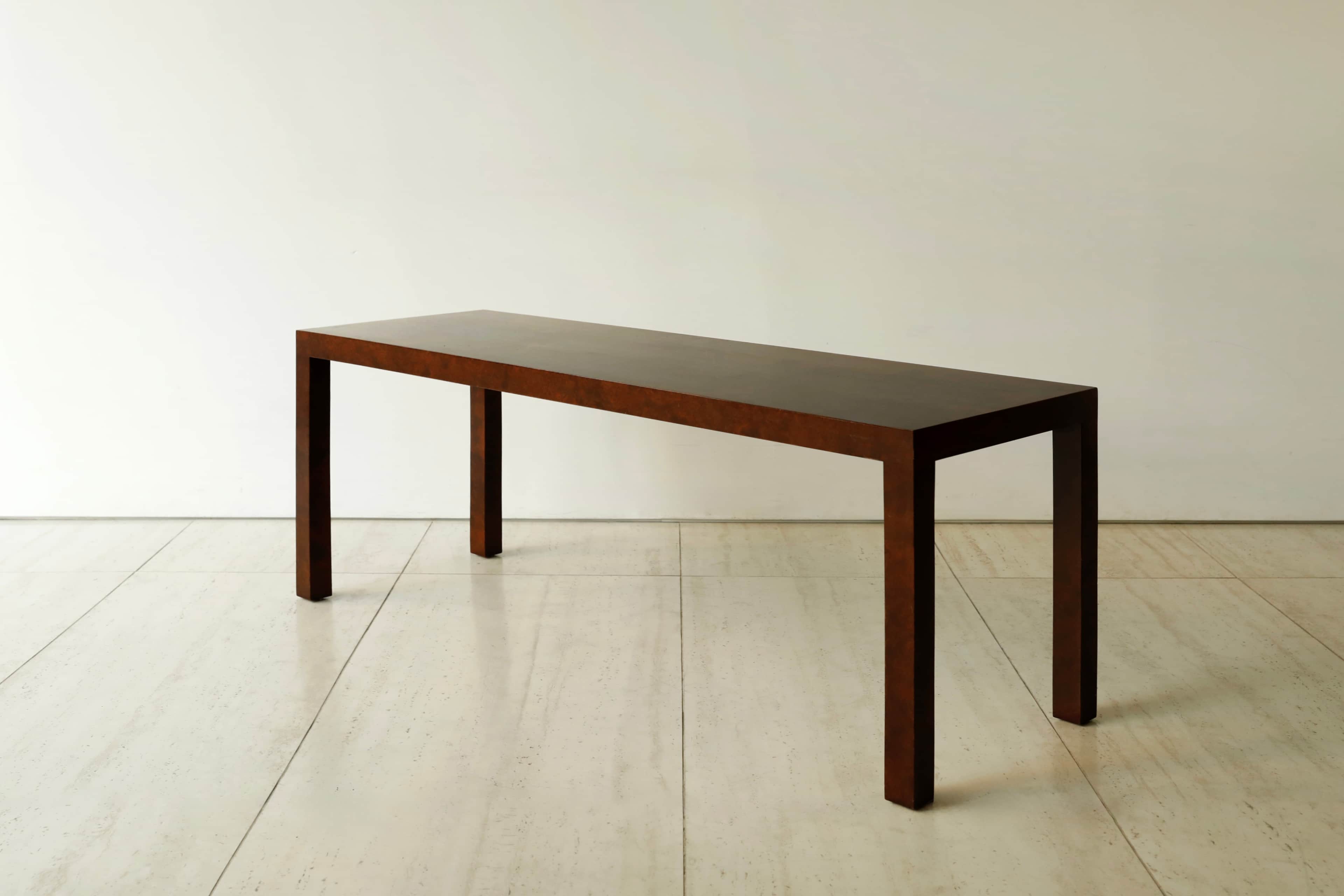 A long, narrow, dark brown console table with a minimalist design, featuring a rectangular top and f… — 3D model
