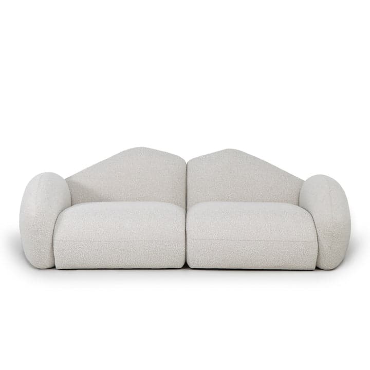 A two-piece modular sofa upholstered in off-white boucle fabric, featuring a contemporary design with soft, rounded edges and asymmetrical backrests. Each module has a distinct, organic shape, contributing to a sculptural aesthetic. — 3D model