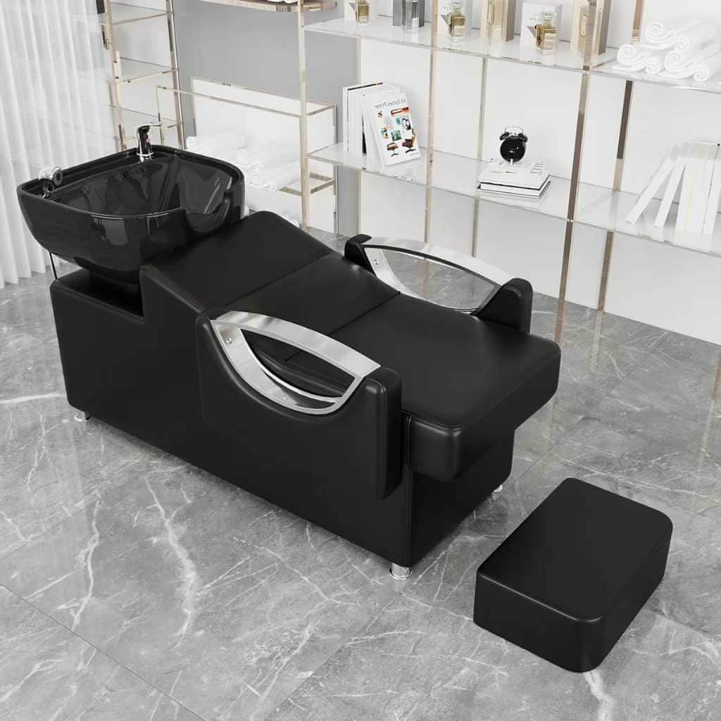 A professional salon shampoo chair with a black upholstered seat and back, an integrated black ceram… — free GLTF 3D model