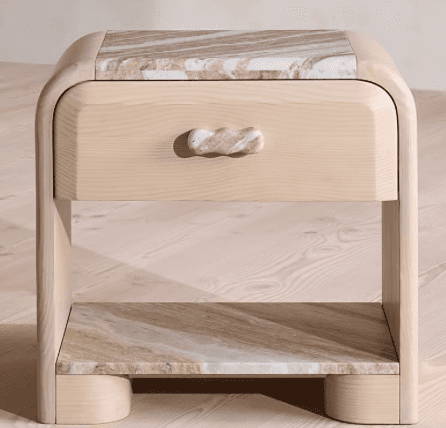 A contemporary nightstand featuring a light-colored wooden frame with soft, rounded edges, complemen… — 3D model