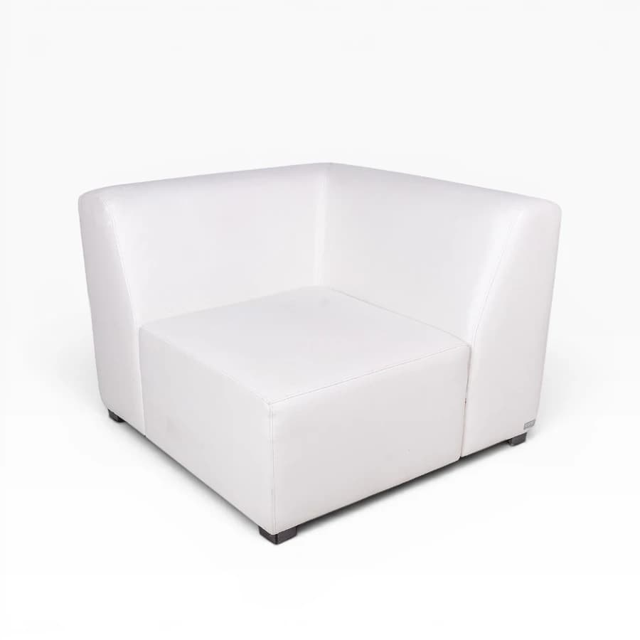 This is a white upholstered modular corner chair, designed to be part of a larger sectional seating arrangement. It features a squared profile with a backrest that wraps around the corner, creating an L-shaped support. The seating surface is flat and firm, and the unit rests on small, recessed black block feet. The upholstery has a smooth, sleek finish. — 3D model
