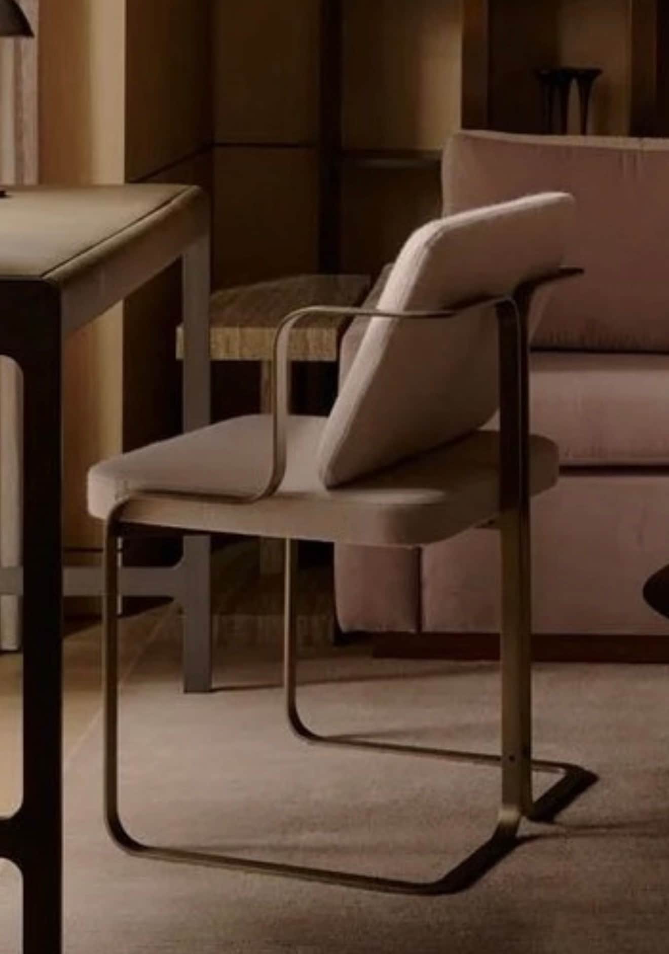 An armchair featuring a contemporary cantilever design with a continuous tubular metal frame in a da… — 3D model