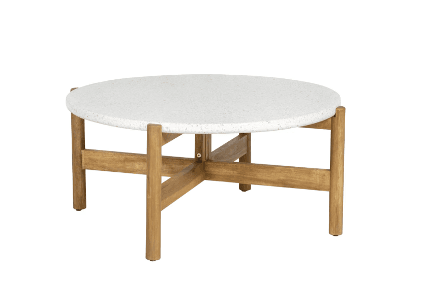 A round coffee table with a speckled white composite top and a wooden base. The base consists of four cylindrical legs connected by intersecting horizontal wooden beams, forming an X-shape structure under the tabletop. — 3D model