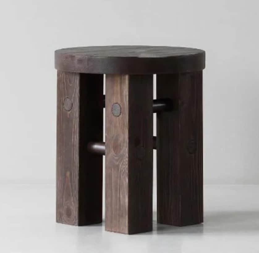 A round-seated stool constructed from dark-stained wood. It features multiple thick, rectangular pla… — 3D model