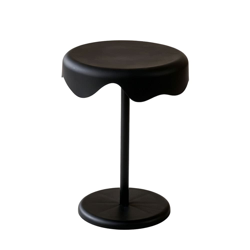 A contemporary black pedestal table featuring a distinctive wavy, scalloped edge on its circular top. It stands on a slender central support column attached to a stable circular base. The table has a matte black finish throughout. — 3D model