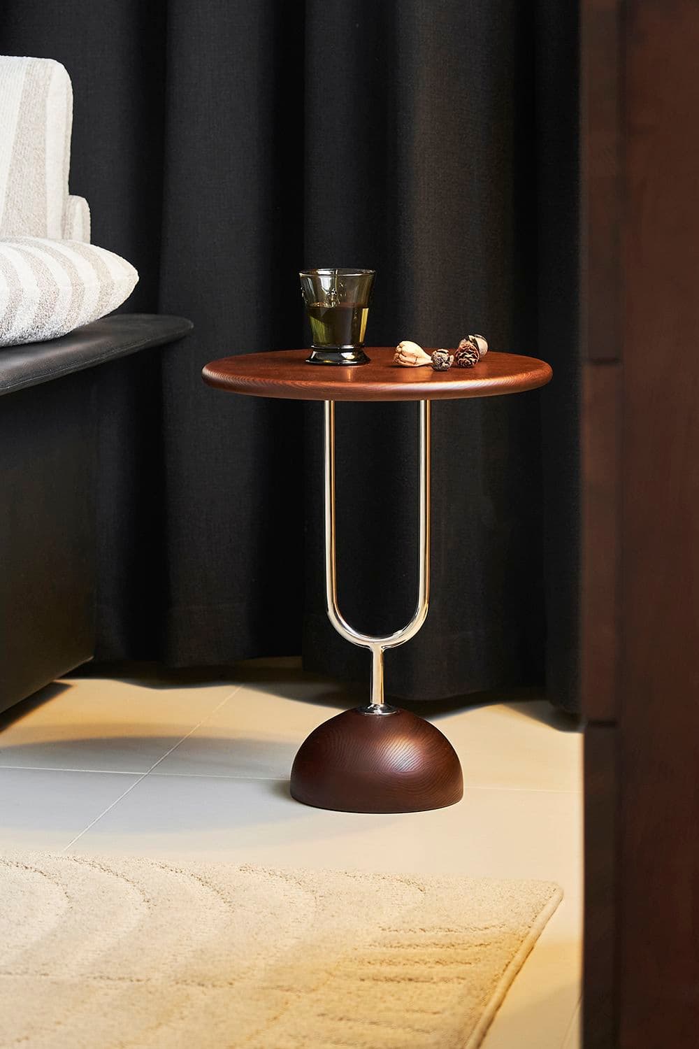 A modern round accent table with a dark brown wood-look top, a chrome-finished curved support, and a matching dark brown dome-shaped base. — 3D model