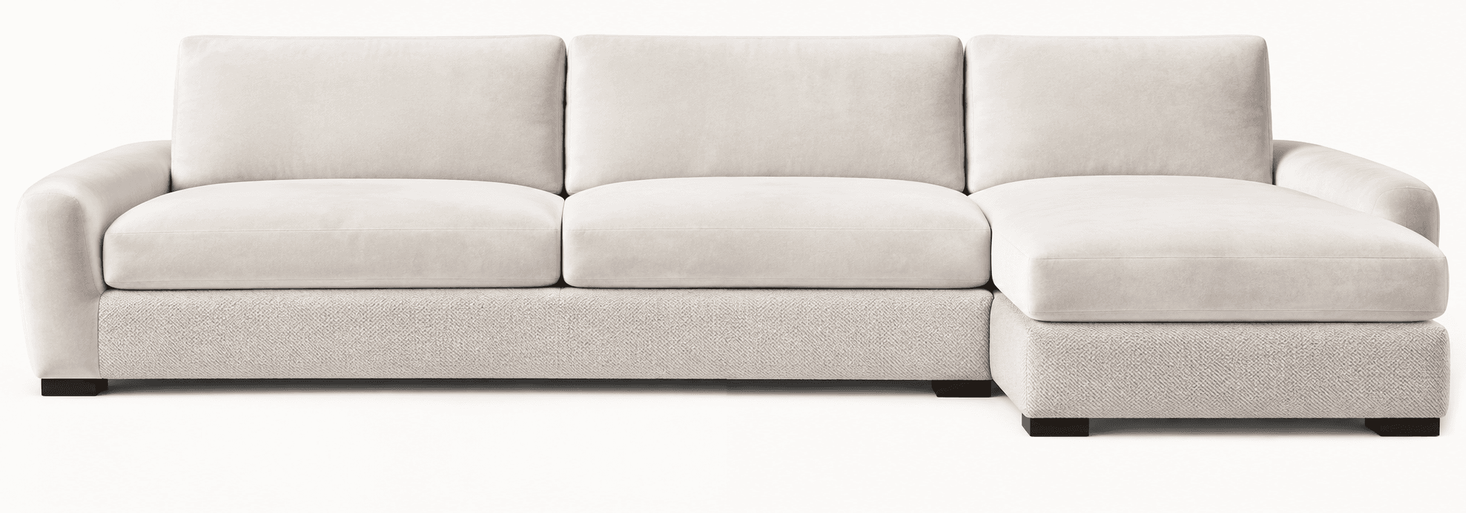 A contemporary sectional sofa featuring a three-seat configuration with a left-hand facing chaise. The sofa is upholstered in two distinct light-colored fabrics: a smooth, soft texture for the seat cushions, back cushions, and armrests, and a subtly patterned, more durable fabric for the base. It features plush, well-defined cushions and low-profile dark block feet, suggesting a modern and comfortable design. — 3D model