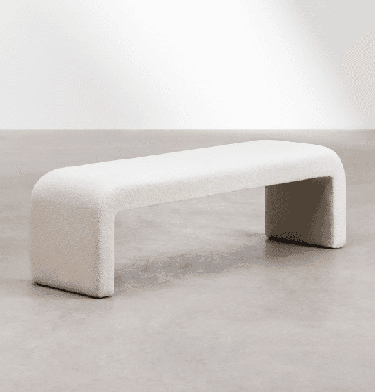 A cream-colored, bouclé upholstered bench with a rounded, continuous form. The bench has a singular,… — 3D model