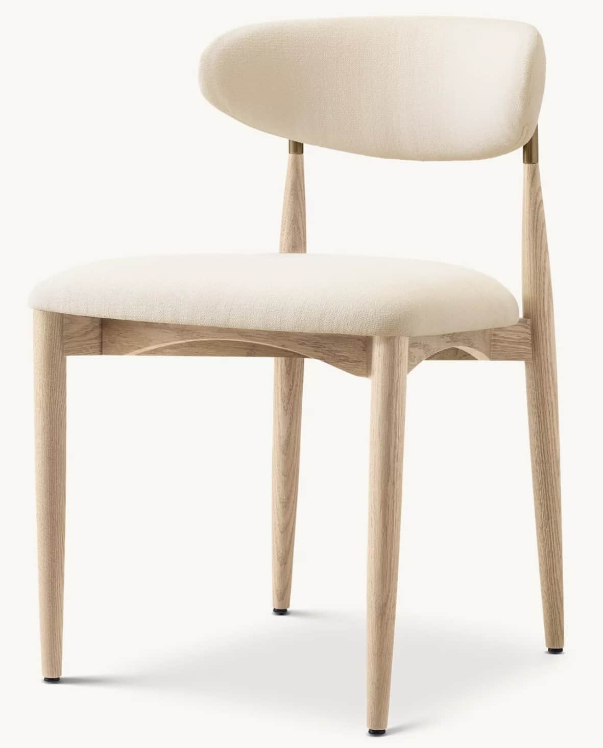 A contemporary dining chair featuring a light-toned wooden frame and cream-colored fabric upholstery… — free GLB 3D model