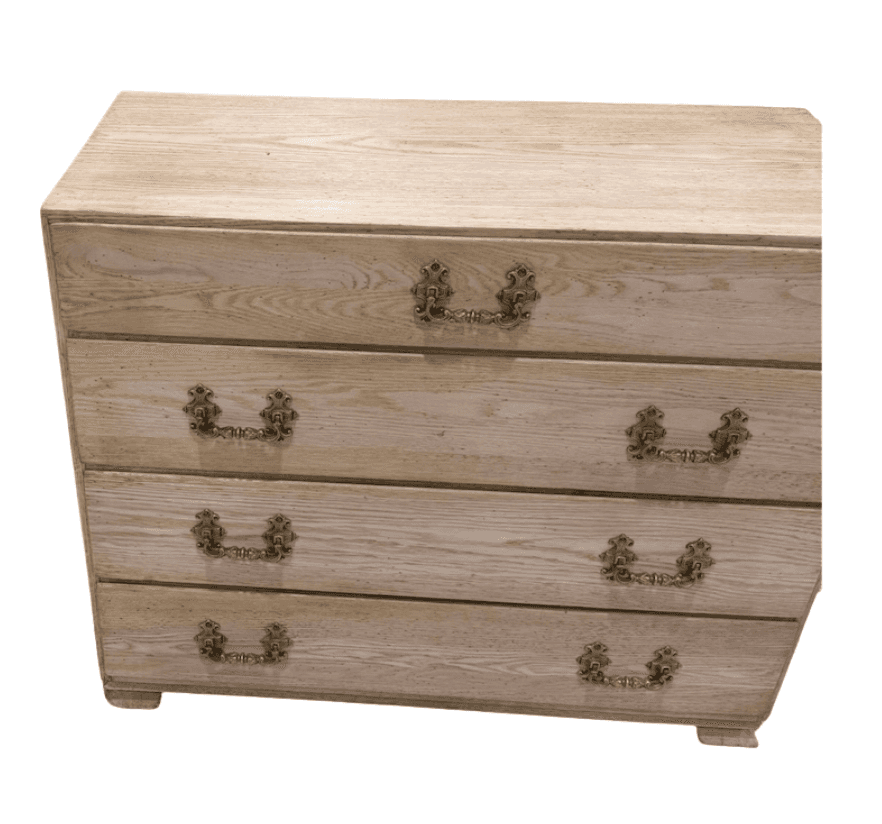 A four-drawer chest of drawers made from bleached oak wood, featuring ornate brass pull handles and… — 3D model