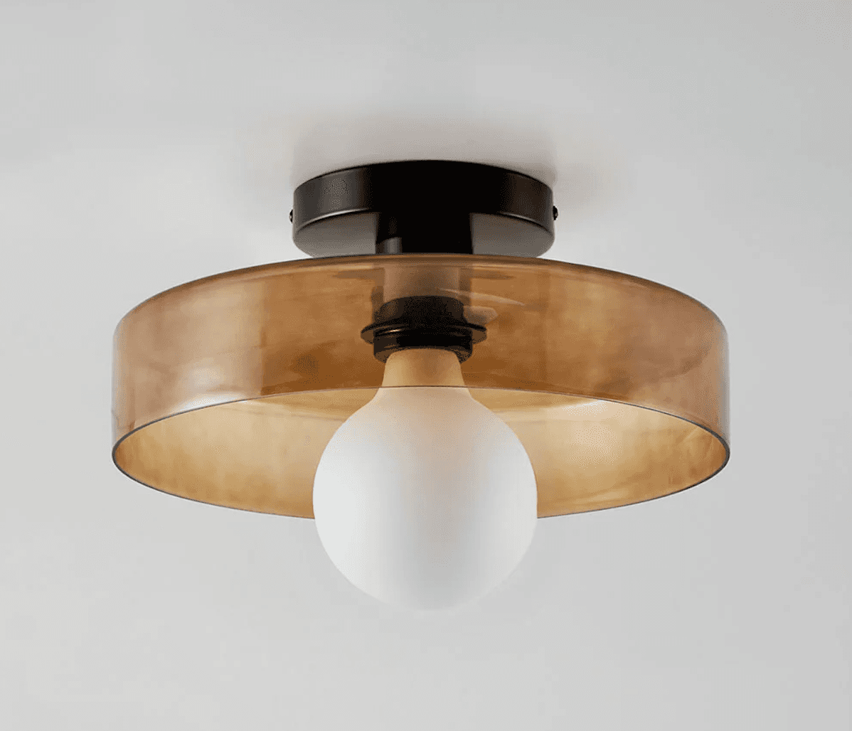 A semi-flush-mount ceiling light with a round black metal canopy, a transparent amber-tinted cylindr… — 3D model