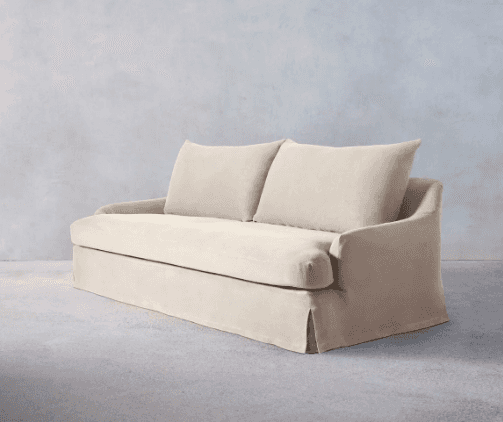 A plush, upholstered sofa with a skirted base and two back cushions. The sofa features rounded armre… — free GLTF 3D model