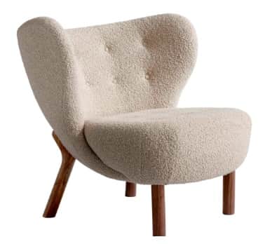 A contemporary armchair with a distinctively curved backrest and seat. The upholstery features a tex… — free OBJ 3D model