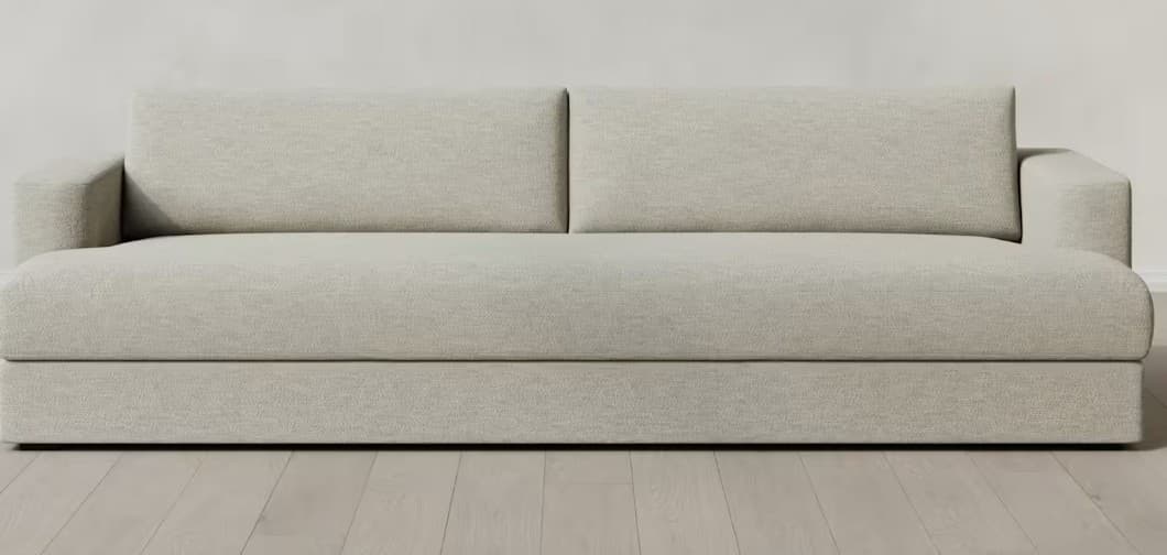 A modern, light grey upholstered seating unit featuring a single armrest and a backrest composed of two separate cushions. The piece has a substantial, low-profile base and seat, indicating a design focused on comfort and lounging. — 3D model