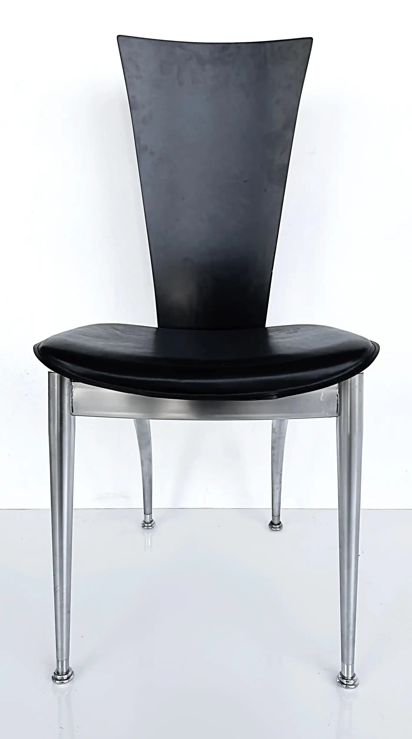 A modern chair featuring a black, curved backrest and a black, cushioned seat. The frame and four tapered legs are constructed from brushed metal, offering a sleek, contemporary aesthetic. The seat appears to be upholstered, possibly in leather or a similar synthetic material, and is supported by a silver-toned metal frame that extends to the legs. — 3D model