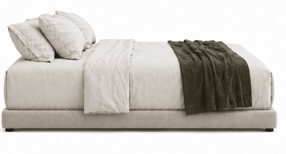 A low-profile upholstered bed frame with a headboard composed of three pillows and bedding. A folded… — free BLEND 3D model