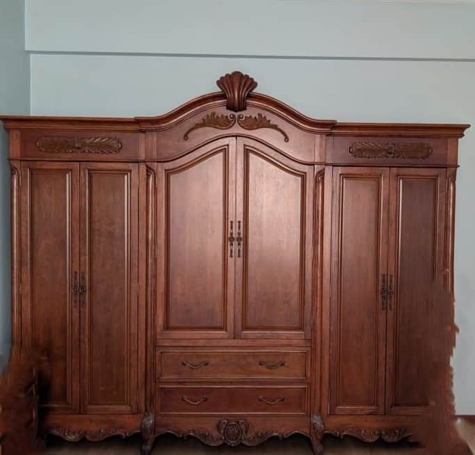 Large, ornate wooden cabinet with multiple doors, drawers, and intricate carvings. — 3D model