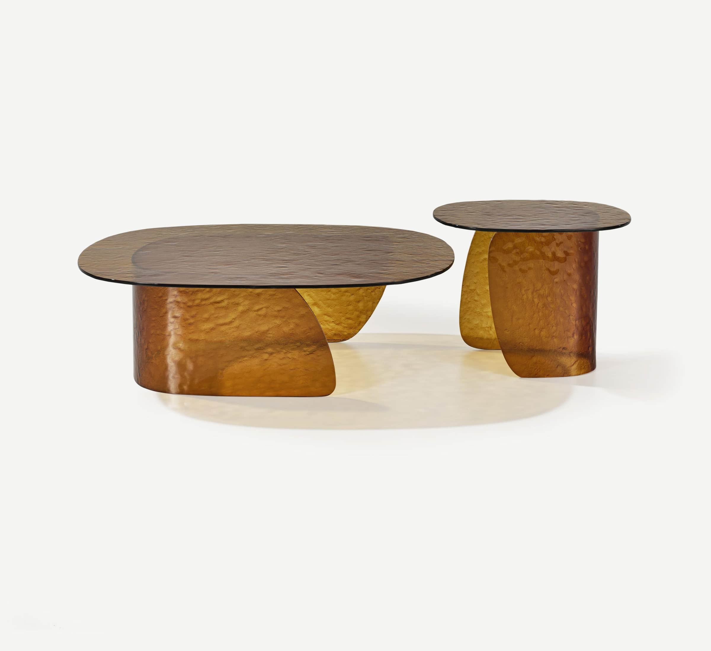 A set of two coffee tables, one oval and one round, with textured amber glass tops and similarly tex… — free SKP 3D model
