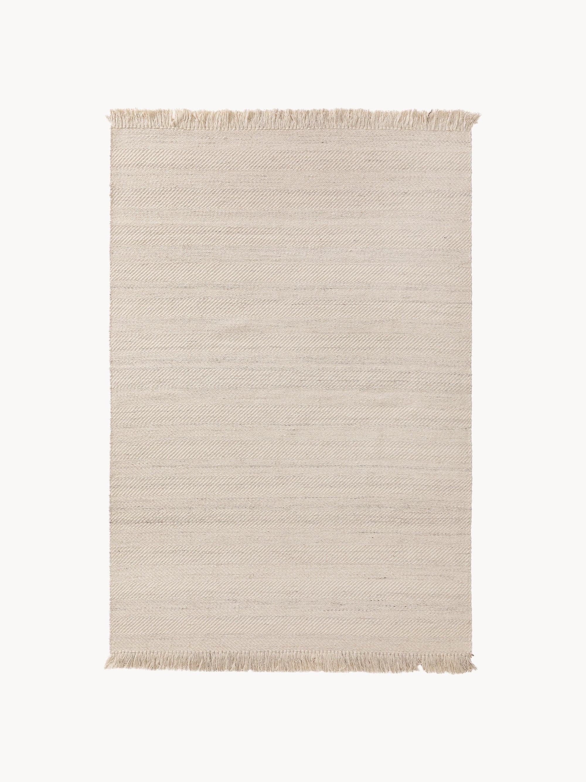 A rectangular area rug in a light, neutral off-white or ecru color, featuring a subtly textured woven pattern. The pattern consists of alternating horizontal bands, with some bands displaying a diagonal herringbone-like weave and others a plainer, tighter horizontal weave. The short edges of the rug are finished with short, unravelled fringe, characteristic of a flat-weave construction. The overall aesthetic is clean, minimalist, and natural. — 3D model