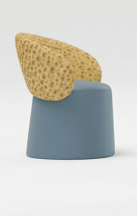 A contemporary sculptural accent chair featuring a unique two-tone design. The low, curved backrest is upholstered in a textured fabric with a detailed, coral-like pattern in muted yellow and tan. The integrated seat and conical, drum-shaped base are covered in a smooth, pale blue faux leather or vinyl material, creating a striking contrast in both color and texture. — 3D model