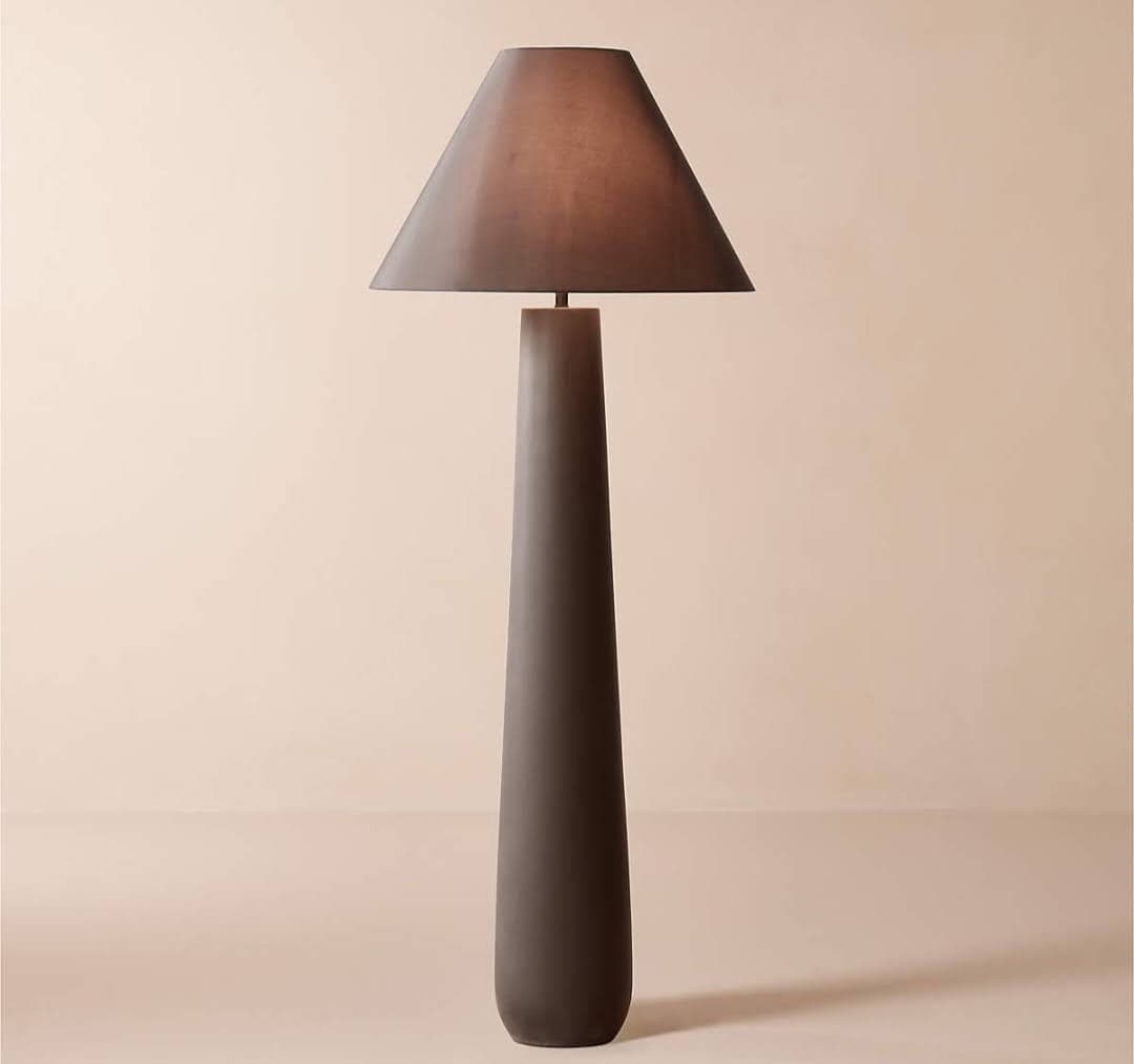 A modern floor lamp featuring a tapering conical base and a matching conical fabric shade, all in a matte dark brown finish. — 3D model