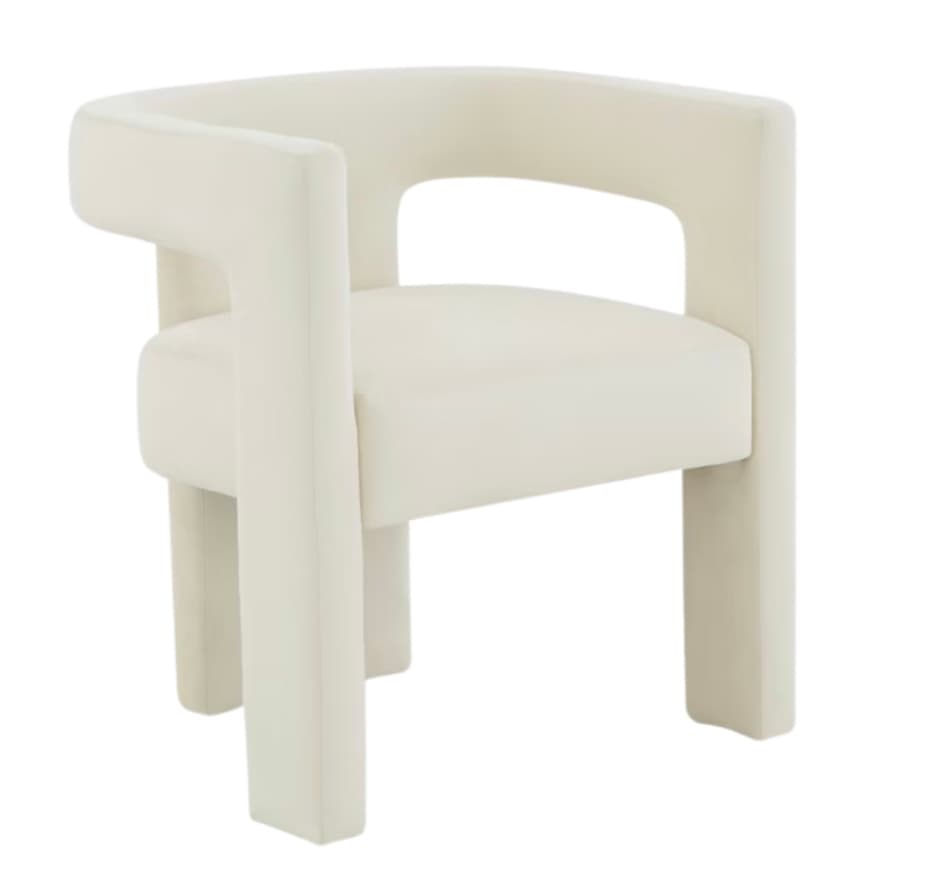 A contemporary armchair with a sculptural, geometric design. The chair features a curved backrest that seamlessly integrates into the armrests, creating a unified, open form. The seat and back are upholstered, providing comfort. The base consists of four thick, rectangular legs that extend from the body of the chair. — 3D model