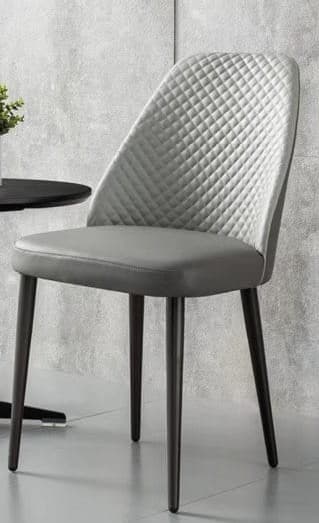 A modern, armless dining chair featuring a grey upholstered seat and a diamond-quilted backrest, supported by four slender, dark, tapered legs. The design is sleek and contemporary. — 3D model