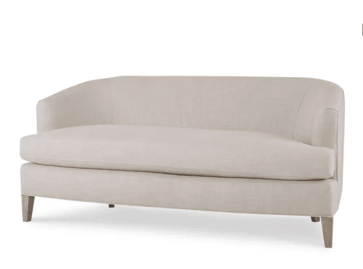 A contemporary sofa with a curved back and sleek, tailored upholstery. It features a single seat cushion and exposed wooden legs that taper slightly. — 3D model