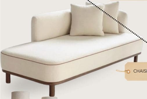 A contemporary chaise lounge featuring light cream bouclé-like upholstery with dark piping, supported by a minimalist dark wood frame and cylindrical legs. It has an asymmetrical design with a single raised backrest/armrest on one side and includes two matching throw pillows. — 3D model