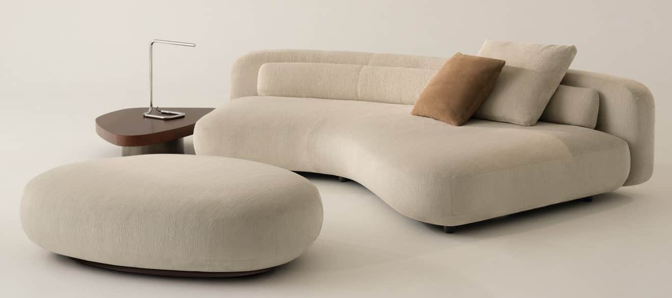 An off-white or cream-colored asymmetrical chaise lounge with soft, organic curves and a low, integr… — 3D model