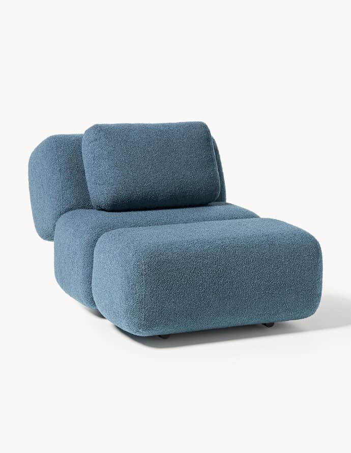 A blue upholstered lounge chair with a low profile and a separate back cushion, featuring a textured boucle fabric. — 3D model