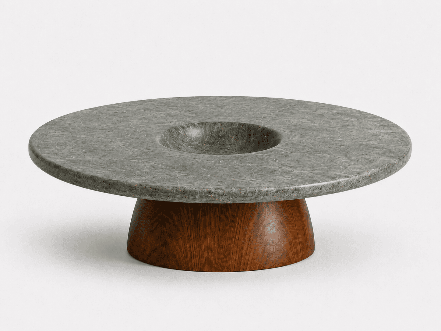 A modern, round coffee table featuring a distinctive dark gray, textured stone top with a central, s… — 3D model