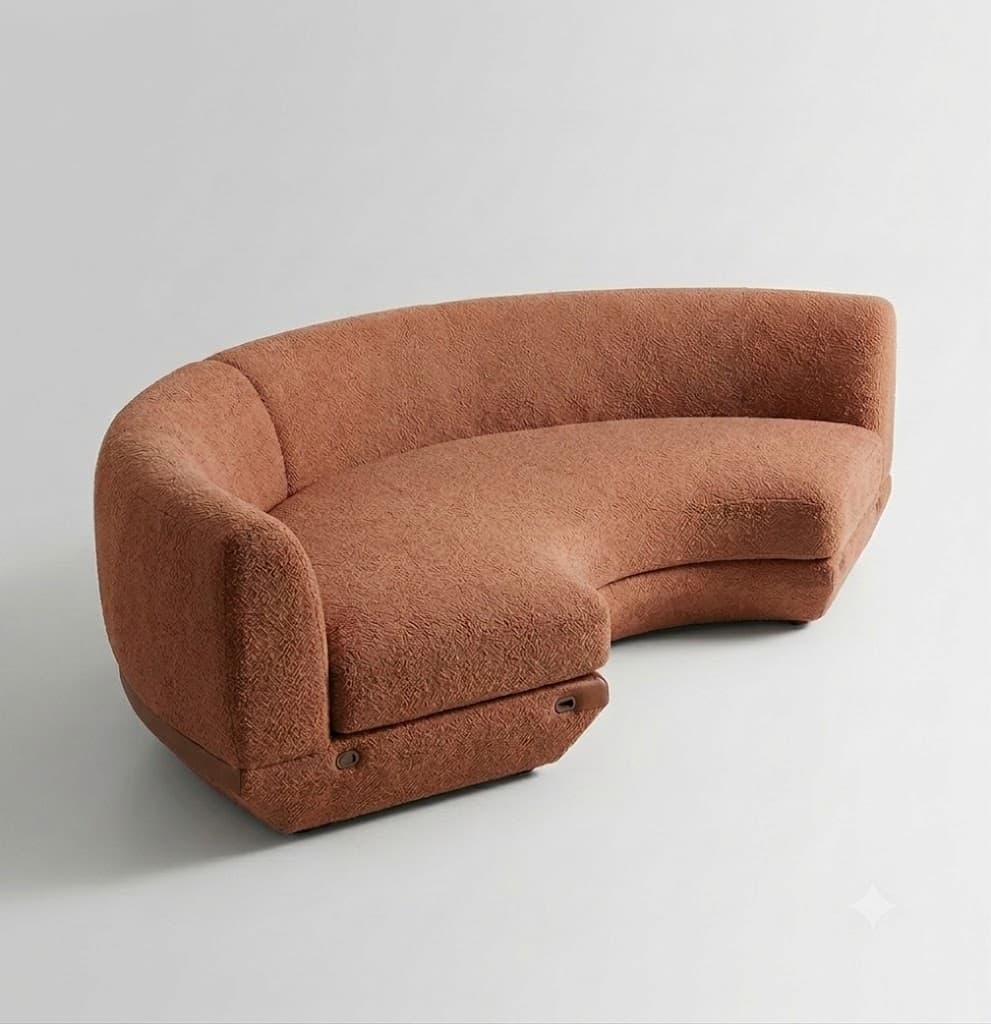 A contemporary curved sectional sofa, upholstered in a warm terracotta or rust-colored boucle fabric. It features a serpentine silhouette with soft, rounded edges and a low-profile design. The backrest is integrated, flowing seamlessly into the seat, and the base is recessed, appearing to rest directly on the floor. Subtle leather-like accents are visible near the bottom edges of the base, adding a distinct detail to the modern aesthetic. — 3D model