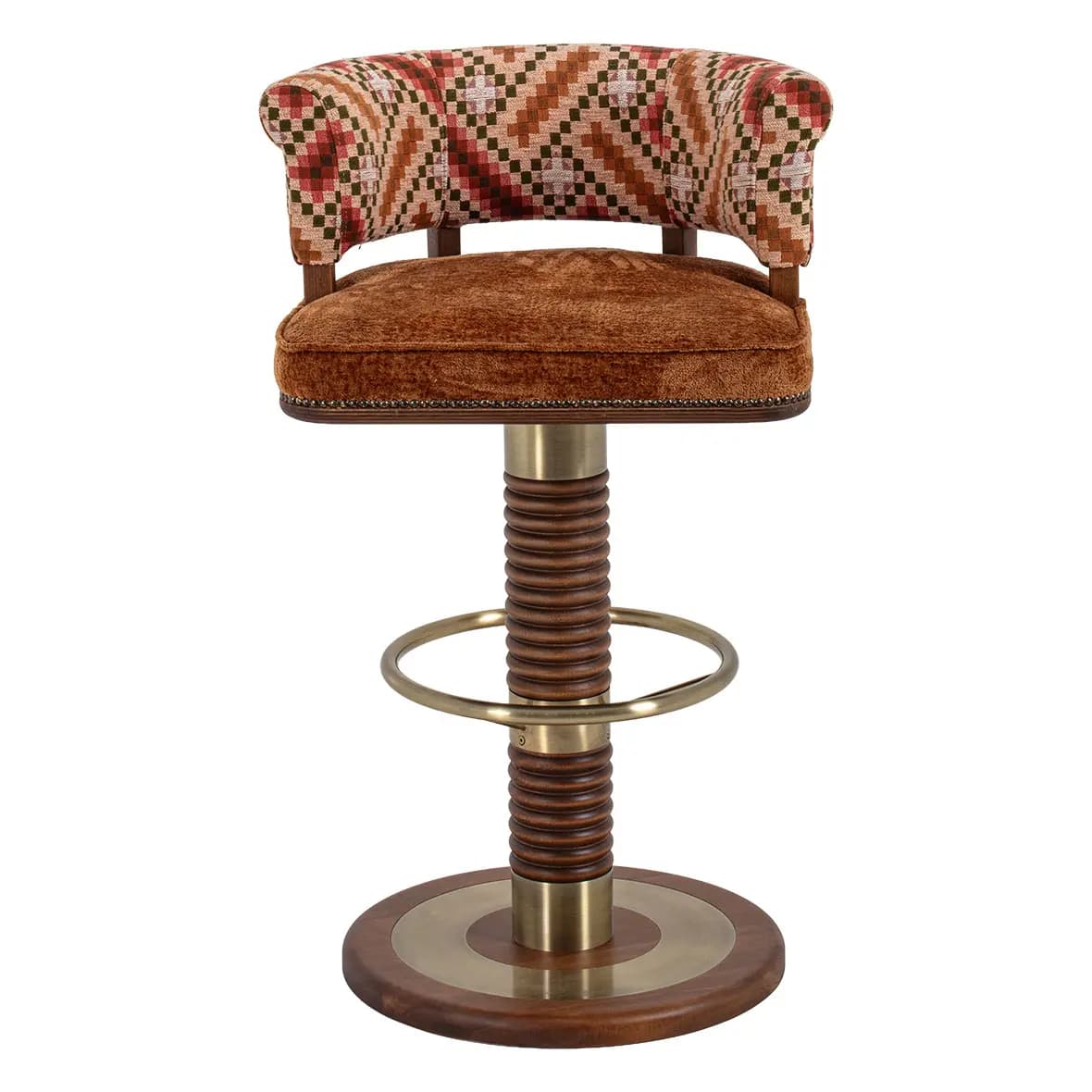 A swivel bar stool featuring a round upholstered seat in brown velvet and a curved, rolled backrest upholstered in a multi-patterned fabric. The central column consists of a brass top and bottom section flanking a distinctive ribbed or spiral-cut wooden segment. A circular brass footrest is integrated into the column, which rests on a round wooden base with a central brass inlay. — 3D model