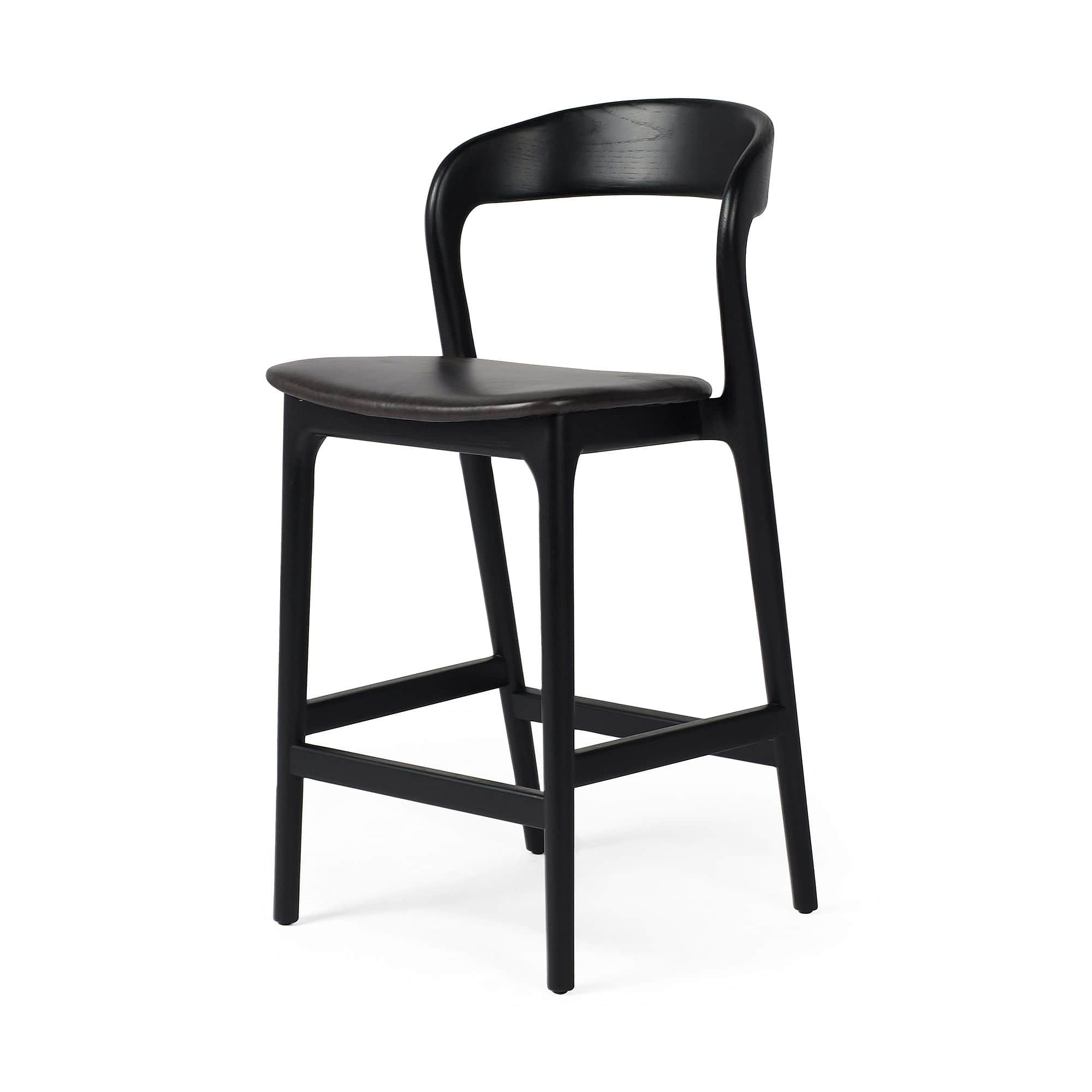 A contemporary bar stool with a black wooden frame and a dark upholstered seat. The stool features a… — 3D model