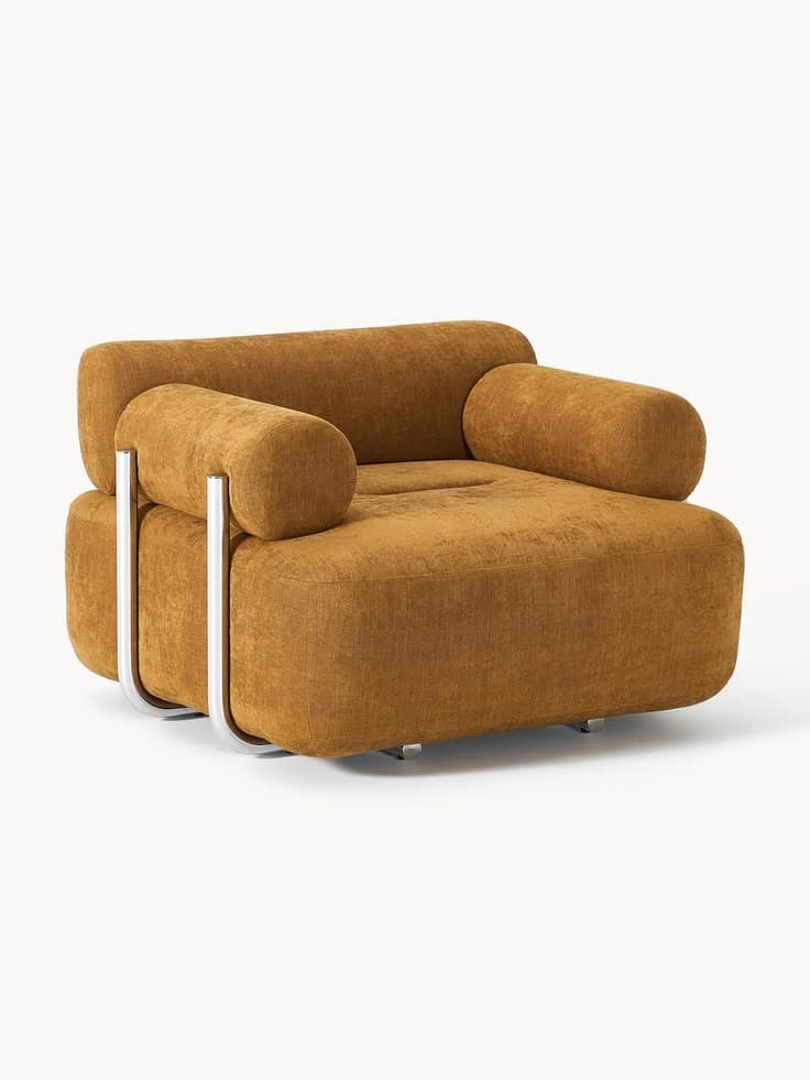 A contemporary lounge chair featuring a distinctive blocky yet rounded form, upholstered in a textured mustard yellow fabric. It incorporates an exposed tubular chrome or polished steel frame that cradles the upholstered body and secures the cylindrical bolster armrests. — 3D model