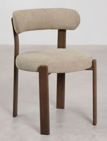 A modern upholstered chair with a wooden frame. The chair features a curved backrest and a round sea… — 3D model