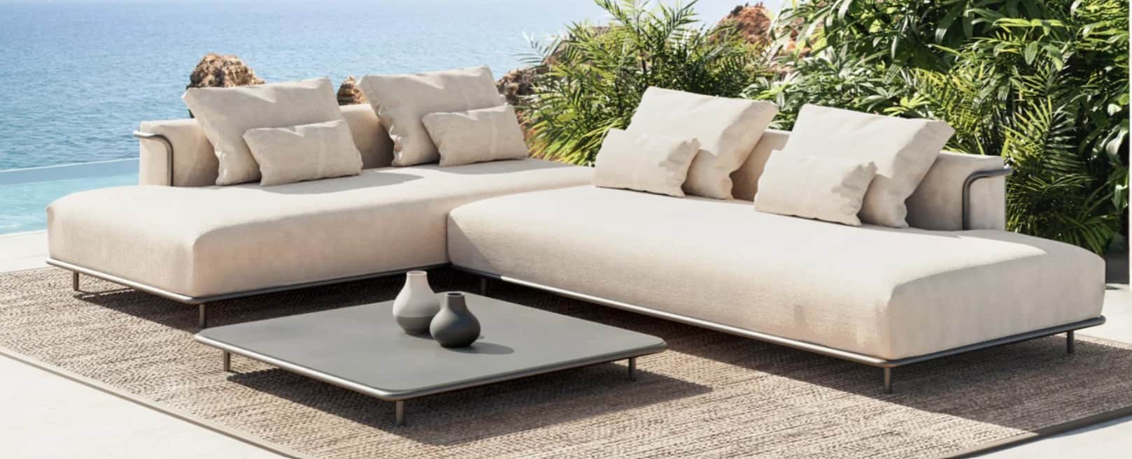 An L-shaped outdoor sectional sofa featuring a minimalist metal frame and light beige, weather-resis… — 3D model