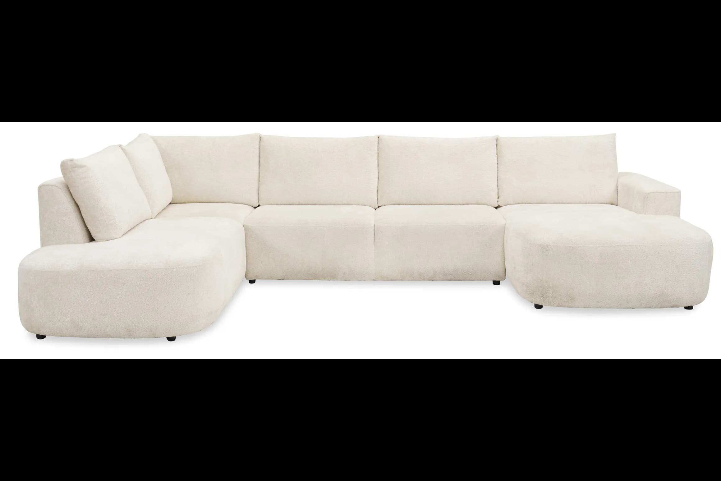 A large, cream-colored sectional sofa with a chaise lounge. The sofa features a modular design with plush, textured upholstery. It has a low profile with rounded arms and a deep seat. The back cushions are rectangular and appear to be loose. — 3D model