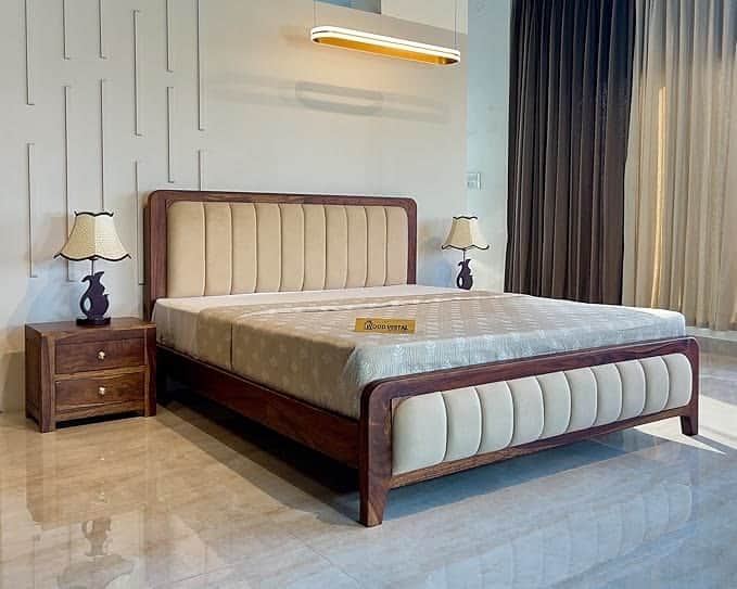 A modern bed frame with a wooden exterior and upholstered headboard and footboard. The bed features… — free OBJ 3D model