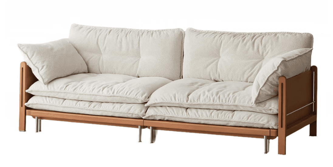 A contemporary three-seater sofa featuring a robust light-toned wooden frame and generously padded, tufted cushions upholstered in a cream-colored fabric. The design includes an exposed rectangular wood frame for the base and armrests, with cylindrical metal legs providing support. The cushions are thick, with piped edges, and offer a low-profile, relaxed seating experience. — 3D model