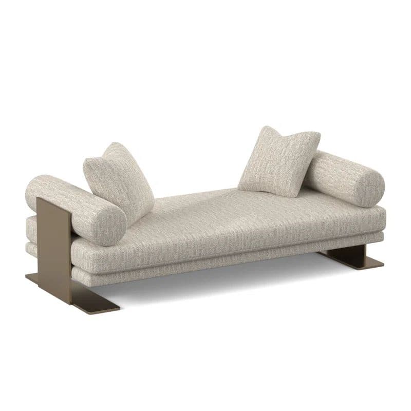 A modern daybed featuring a long, rectangular upholstered mattress in a light beige, textured fabric. The daybed is supported by a minimalist dark metal frame that extends upwards at the ends to hold cylindrical bolster pillows. Two square throw pillows are also placed on the bed. The overall design is sleek and contemporary. — 3D model