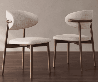 A modern dining chair featuring a dark wood frame and light-colored fabric upholstery. The chair has… — 3D model