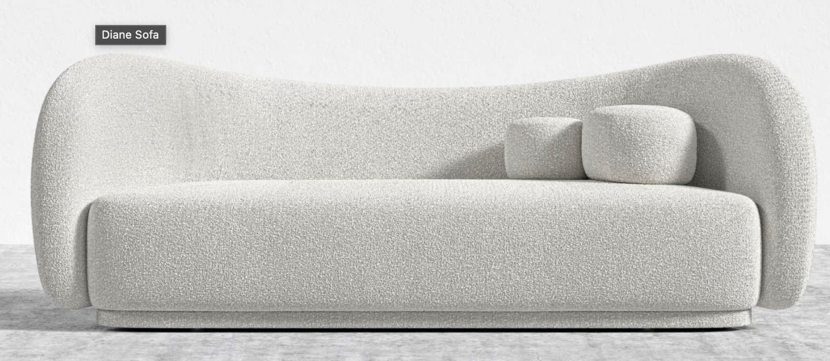 A contemporary two-seater sofa, identified as the "Diane Sofa," upholstered in a textured off-white boucle fabric. It features a distinctive, organically curved backrest and integrated rounded armrests, creating a cohesive, sculptural form. The sofa rests on a recessed plinth base, giving it a low-profile appearance. Two small, matching decorative cushions are included on the seat. — 3D model
