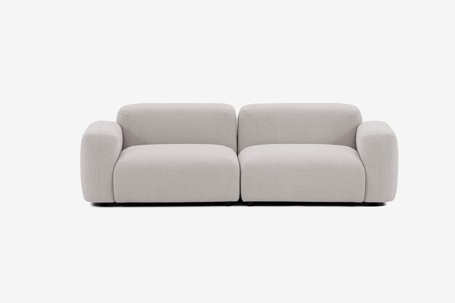 A two-seater sofa with a low profile and rounded arms and back. The sofa is upholstered in a light-colored, textured fabric and features a modular design with two distinct seat cushions. — 3D model